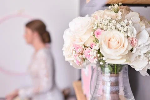 Wedding bouquet with a bride in the background Stock Photos