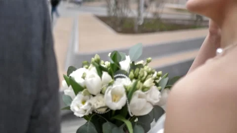 Wedding bouquet in the hands of a beautiful bride. wedding bridal bouquet Stock Footage 306532196