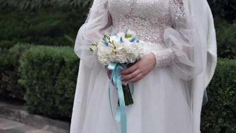 Wedding bouquet in the hands of a beautiful bride. wedding bridal bouquet Stock Footage 331210889