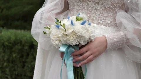 Wedding bouquet in the hands of a beautiful bride. wedding bridal bouquet Stock Footage 331515432