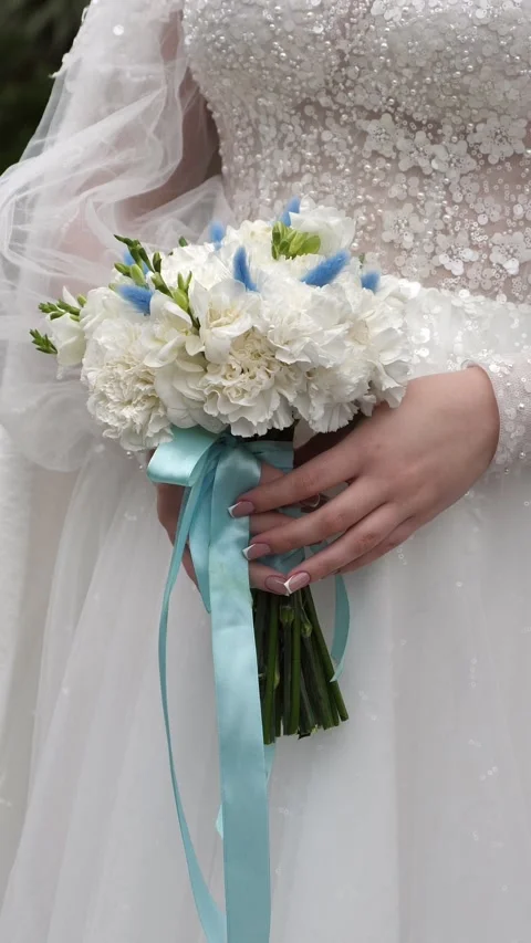 Wedding bouquet in the hands of a beautiful bride. wedding bridal bouquet Stock Footage 331515433