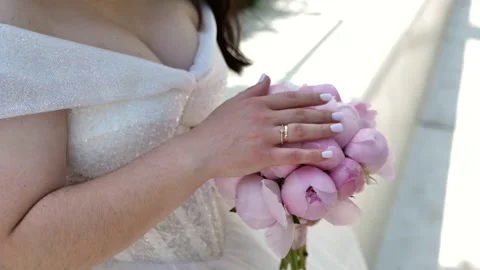 Wedding bouquet in the hands of a beautiful bride. wedding bridal bouquet Stock Footage 337578268