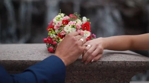 Wedding bouquet in hands of the bride and groom Stock Footage 52512481