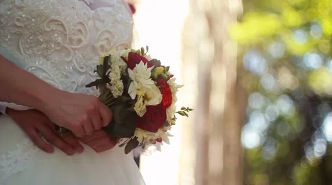 Wedding bouquet in hands of the bride Stock Footage 51573848