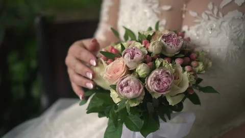 Wedding bouquet in the hands of the bride Stock Footage 167417569