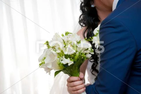 Wedding bouquet in hands of the bride Stock Photos