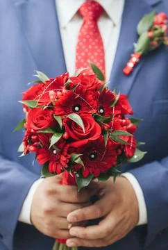 Wedding bouquet in hands of the bride Stock Photos