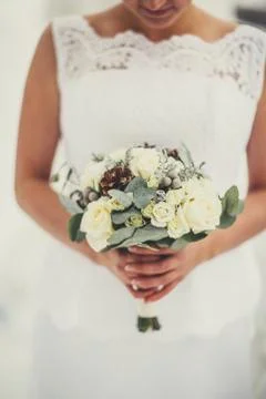 Wedding bouquet in hands of the bride 库存照片