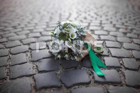 Wedding bouquet on the paving stones Stock Photos