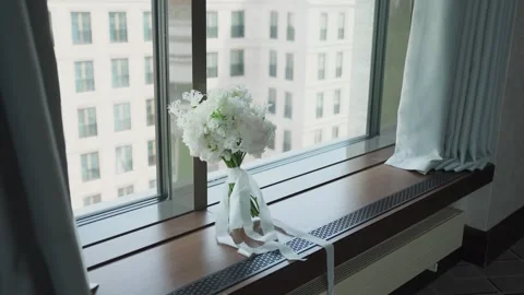 A wedding bouquet stands on the window Video stock 329092673