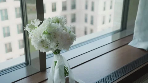 A wedding bouquet stands on the window Stock Footage 329092685