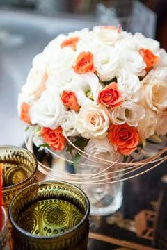 Wedding bouquet surrounded by colored patterned glass Stock Photos