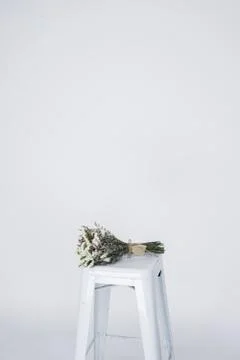 Wedding bouquet on a white chair. Stock Photos