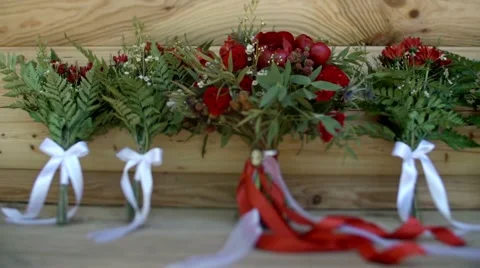 Wedding bouquets on a wooden background in rustic style, bouquet falling Stock Footage 62808525