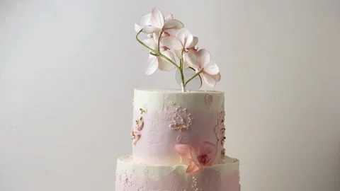 Wedding bunk cake with pink and white cream cheese frosting Stock Footage 237332131