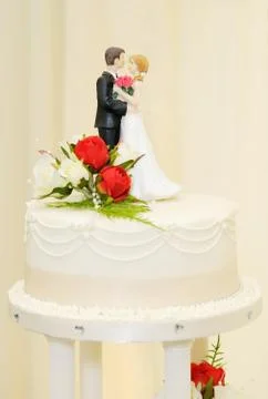 Wedding cake and topper Stock Photos