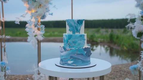 Wedding cake beautifully decorated on a beautiful background, slow motion camera Video stock 328315053