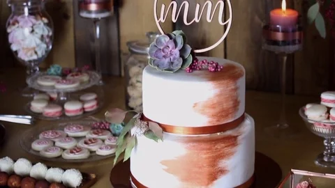 Wedding cake copper style sweet table bronze cake topper white Stock Footage 72411380