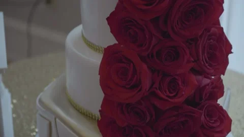 Wedding cake decorated with dark red roses. Stock Footage 148893765