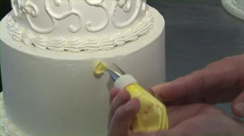 Wedding Cake Decorating with Yellow Flowers Stock Footage 40796359