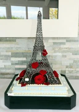 Wedding cake as eiffel tower with red roses Stock Photos