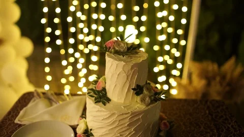 Wedding cake in the evening under the arch Stock Footage 125333487
