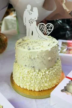 Wedding cake on the festive table Stock Photos