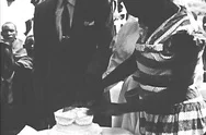 A Wedding Cake Gets Cut And Served To Black People, As They Listen To A Radio, Stock Footage