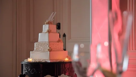 Wedding cake rack focus to close up of table settings Video stock 91936988