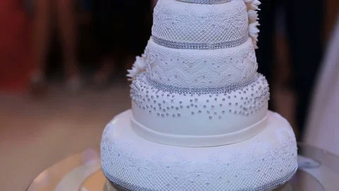 Wedding Cake is ready for cutting and eating by couple in love Stock Footage 80968416