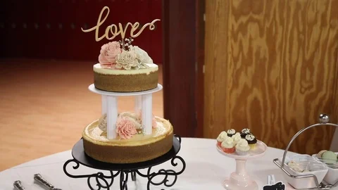 Wedding Cake Topped with Love Stock Footage 116442964