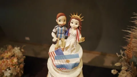 Wedding cake topper for the bride and groom, cake decorated with Stock Footage 270234537