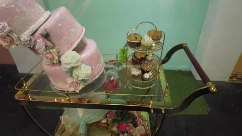 Wedding cake with various sweets on the tray for tea time Stock Footage 320988439
