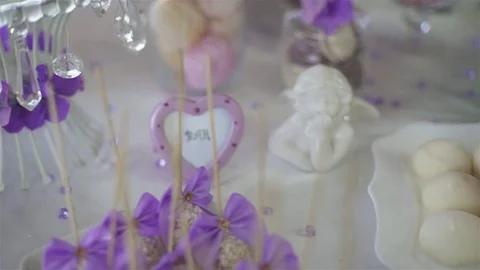 Wedding cakes and flowers. Sweet balls. Empty glasses with straws. Pancake. Stock Footage