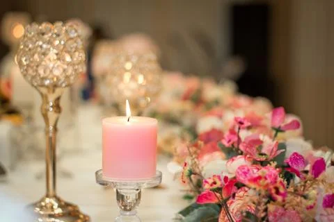 Wedding candle on a table. Stock Photos