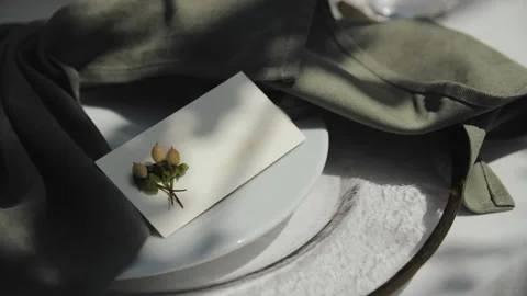 Wedding celebration dinner. Close-up on a plate. Table setting with green Stock Footage 307919219