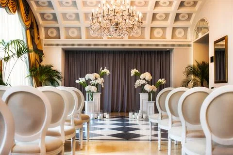 Wedding ceremony set up inside. Stock Photos