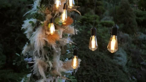 Wedding ceremony. wedding arch in boho style with garland lamps Stock Footage 295126391