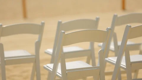 Wedding chairs set up with multicolored rose bouquet in foreground Video stock 120407408