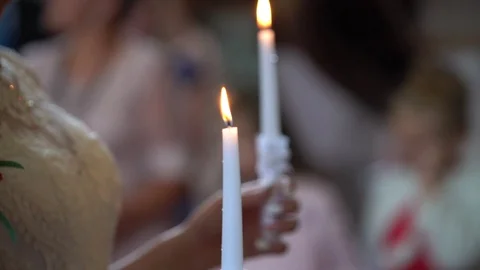 Wedding, close up, Bride and groom holding candles in church HD Video stock 125309587