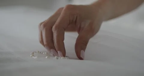 Wedding. Close up shot. Bride adjusting the bracelet while wearing a beautiful Stock Footage 172609177