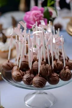 The wedding composition of delicious sponge fruit cakes decorated with juicy che Stock Photos