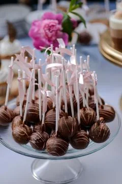 The wedding composition of delicious sponge fruit cakes decorated with juicy che Stock Photos