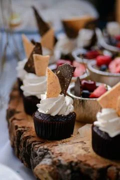 The wedding composition of delicious sponge fruit cakes decorated with juicy che Stock Photos