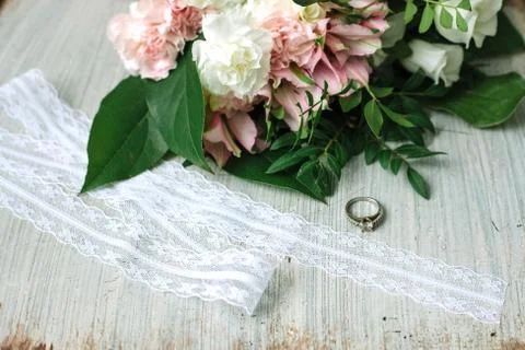 Wedding composition with flowers, ring and chair. Stock Photos