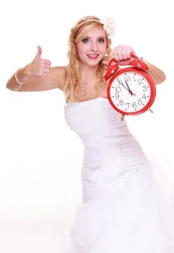 Wedding concept. time to get married. bride with clock. Stock Photos