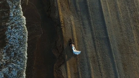 Wedding couple on the beach lying down on sand. Sunset light. Tropical marriage Stock Footage 124465063