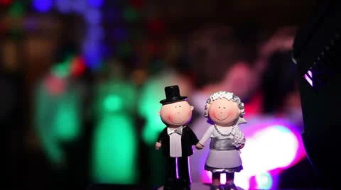 Wedding couple figures on cake during party Stock Footage 22485131
