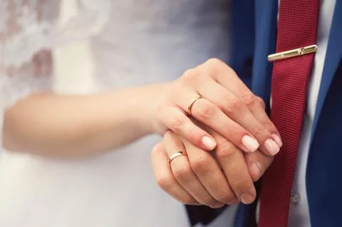 Wedding couple holding hands Stock Photos