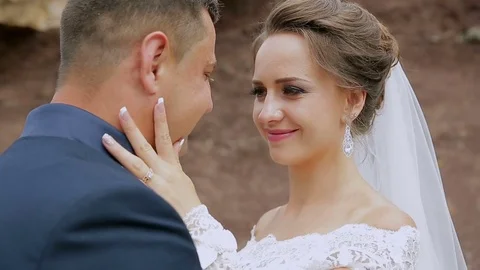 Wedding couple on the nature is hugging each other. Beautiful model girl in Stock Footage 77187772